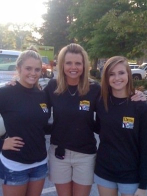 Bailey and two friends working at the Cheerios Challenge