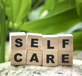 self care spelled out in wooden blocks 