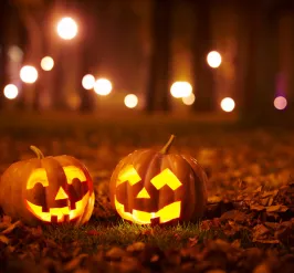 two smiling carved pumpkins