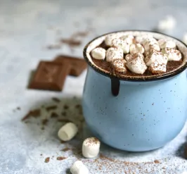 a cup of hot chocolate with mushrooms on top