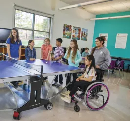 group of diverse abilities children playing ping pong