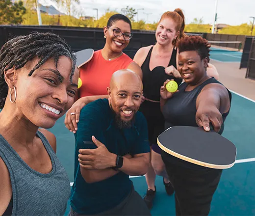 Group playing pickleball