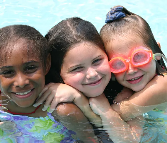 3 happy girls swimming