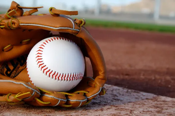 a baseball in a baseball glove