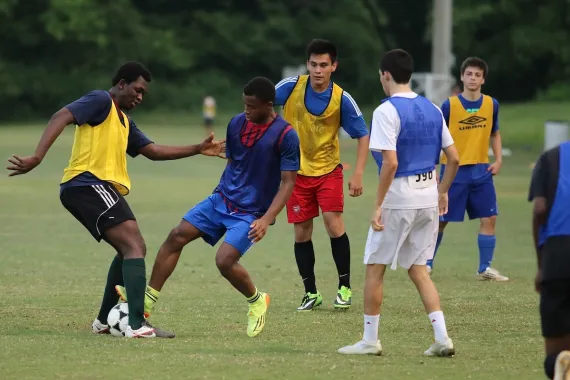 teens playing soccer