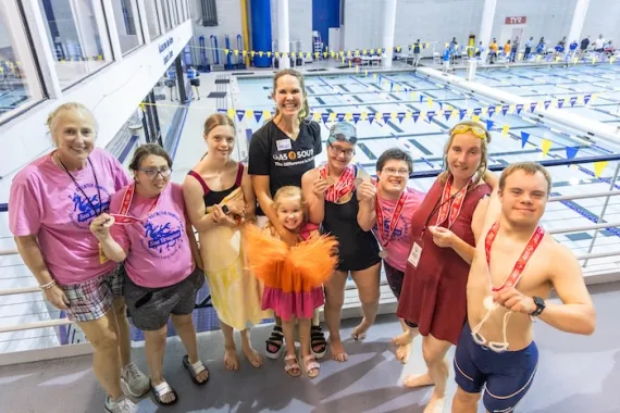 adaptive swim team posing for a photo