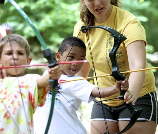 2 boys practicing Archery