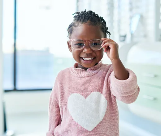 young girl wearing glasses