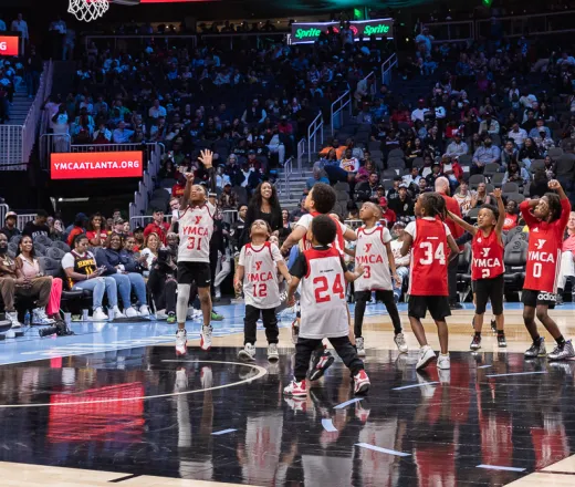 Kids playing on Hawks court in State Farm Arena